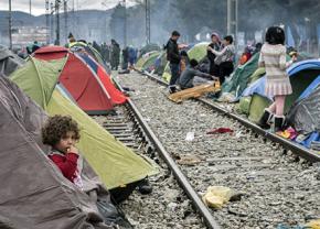 Refugee families stranded in a camp in Greece